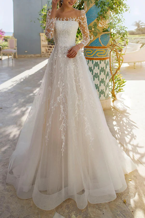 Line illusion neckline long sleeved lace trailing wedding dress